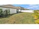 Large backyard with well-kept lawn and white fence, offering privacy and space for outdoor activities at 14330 Fissore Blvd, Wimauma, FL 33598