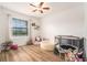 Spacious Bedroom with hardwood floors, a ball pit, and a cozy play area at 14330 Fissore Blvd, Wimauma, FL 33598