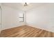 Bedroom with a window and wood-look flooring at 14330 Fissore Blvd, Wimauma, FL 33598