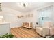 Bright Bedroom with a white crib, cozy chair, and stylish decor, perfect for a new baby at 14330 Fissore Blvd, Wimauma, FL 33598