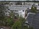 Aerial view of condo complex with parking and surrounding landscape at 1546 Pleasant Rd # J1, Bradenton, FL 34207