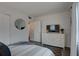 Comfortable bedroom with a TV, dresser, and closet space, offering a relaxing retreat at 1546 Pleasant Rd # J1, Bradenton, FL 34207