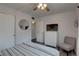 Bedroom featuring a queen bed, modern decor, and closet at 1546 Pleasant Rd # J1, Bradenton, FL 34207