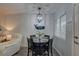 Cozy dining area with a modern chandelier and comfortable seating, perfect for Gathering meals and gatherings at 1546 Pleasant Rd # J1, Bradenton, FL 34207