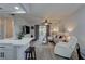 Bright living room with gray flooring, comfortable seating, and sliding glass doors leading to outdoor space at 1546 Pleasant Rd # J1, Bradenton, FL 34207