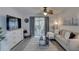 Cozy living room with gray sofa, wood flooring, and access to the lanai at 1546 Pleasant Rd # J1, Bradenton, FL 34207