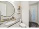 Modern bathroom with granite countertops, a sleek mirror, and stylish fixtures at 16407 Frehley Run, Land O Lakes, FL 34638