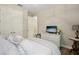 Well-lit bedroom with a serene ambiance, featuring hardwood floors and closet at 16407 Frehley Run, Land O Lakes, FL 34638