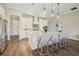 Beautiful kitchen features a large island with seating and stylish pendant lighting at 16407 Frehley Run, Land O Lakes, FL 34638