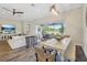 Open-concept living area with great outdoor views, seamlessly connecting to dining space and outdoor living at 16407 Frehley Run, Land O Lakes, FL 34638