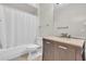 Bathroom featuring a vanity with marble top, a mirror and a bathtub with shower curtain at 17108 Carrington Park Dr # 701, Tampa, FL 33647