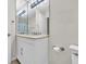 Bathroom features a large mirror above the sink and a visible shower-tub with patterned curtain at 17108 Carrington Park Dr # 701, Tampa, FL 33647