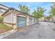 Exterior shot of the detached garages with well-maintained landscaping in front of each one at 17108 Carrington Park Dr # 701, Tampa, FL 33647