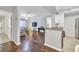 Open-concept living room with hardwood floors, ceiling fan, and views to the dining area at 17108 Carrington Park Dr # 701, Tampa, FL 33647