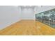 Bright racquetball court with hard wood flooring and large glass doors to watch the game at 17108 Carrington Park Dr # 701, Tampa, FL 33647