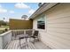 A cozy deck area with table and chair is perfect for relaxing outside at 1777 Apache Trl, Clearwater, FL 33755