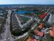 Aerial view of townhomes nestled by scenic lakes, highlighting the community's desirable location at 1986 Lake Ridge Blvd, Clearwater, FL 33763
