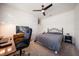 Cozy bedroom featuring a bed, ceiling fan, and ample space for relaxation and work at 1986 Lake Ridge Blvd, Clearwater, FL 33763
