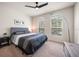 Serene bedroom features natural light, a ceiling fan, and neutral decor for a relaxing atmosphere at 1986 Lake Ridge Blvd, Clearwater, FL 33763