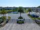 Aerial view of the community entrance showing palm trees and well maintained landscaping around the lake at 1986 Lake Ridge Blvd, Clearwater, FL 33763