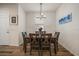 Cozy dining room featuring a wooden table set with four chairs and wood-look plank flooring at 1986 Lake Ridge Blvd, Clearwater, FL 33763