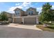 Attractive two-story townhome featuring an attached two-car garage, manicured lawn, and welcoming curb appeal at 1986 Lake Ridge Blvd, Clearwater, FL 33763