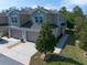 A beautiful two-story townhome with attached garage and a well-maintained yard with mature landscaping at 1986 Lake Ridge Blvd, Clearwater, FL 33763