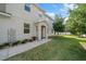 Charming front entrance with manicured landscaping, a walkway to the front door, and a welcoming porch at 1986 Lake Ridge Blvd, Clearwater, FL 33763