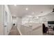 Bright hallway with carpeted floors and white trim leads to an open living space at 1986 Lake Ridge Blvd, Clearwater, FL 33763