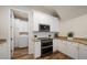 Laundry room with white cabinets and a newer washer and dryer at 1986 Lake Ridge Blvd, Clearwater, FL 33763