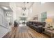 Spacious living room showcasing tall ceilings, plank floors, and a sliding glass door to the patio at 1986 Lake Ridge Blvd, Clearwater, FL 33763