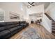 Open floor plan featuring a living room, kitchen, dining area, and stairway at 1986 Lake Ridge Blvd, Clearwater, FL 33763