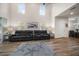 Bright living room featuring two reclining sofas and plank flooring with area rug at 1986 Lake Ridge Blvd, Clearwater, FL 33763