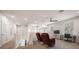 Bright loft space with carpeted floors offers a versatile living area with natural light and a ceiling fan at 1986 Lake Ridge Blvd, Clearwater, FL 33763