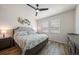 Spacious main bedroom features a neutral palette, wood-look floors, and bright natural light at 1986 Lake Ridge Blvd, Clearwater, FL 33763