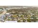 Real estate overview of a diverse neighborhood, blending residential homes with commercial areas by the waterway at 208 Palmetto W Rd, Nokomis, FL 34275