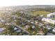 A high aerial shot of the community, buildings, and green spaces at 208 Palmetto W Rd, Nokomis, FL 34275