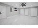 Spacious basement with tile floors, ceiling fan, and closet space at 208 Palmetto W Rd, Nokomis, FL 34275