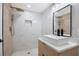 Bright bathroom with a large shower with gold fixtures and a stylish vanity with a modern vessel sink at 208 Palmetto W Rd, Nokomis, FL 34275