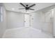 Large bedroom with ceiling fan, closet organizer, and neutral paint scheme at 208 Palmetto W Rd, Nokomis, FL 34275