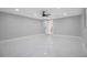 Large bedroom with sleek marble floors, modern ceiling fan, and ensuite bathroom at 208 Palmetto W Rd, Nokomis, FL 34275