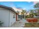 Rear exterior view of the house with a hot tub and screened in porch at 208 Palmetto W Rd, Nokomis, FL 34275