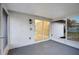 Covered and screened outdoor patio with ceiling and sliding glass door at 208 Palmetto W Rd, Nokomis, FL 34275