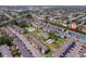An aerial view of the community showcasing the buildings, green spaces, pool, and parking at 2113 Canal Dr # B2, Bradenton, FL 34207