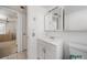 Bathroom features a white vanity, medicine cabinet, and a neutral color scheme at 2113 Canal Dr # B2, Bradenton, FL 34207