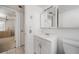 Bathroom featuring a white vanity, neutral tile flooring, and a mirror/medicine cabinet at 2113 Canal Dr # B2, Bradenton, FL 34207