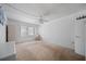 Neutral bedroom with fan, light walls, and carpeted floors offers a serene, minimalist design at 2113 Canal Dr # B2, Bradenton, FL 34207