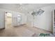 Bedroom with neutral carpet, ceiling fan, walk-in closet and access to an ensuite bath at 2113 Canal Dr # B2, Bradenton, FL 34207