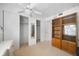 Bedroom with built-in closets, bookcases and an ensuite, complemented by carpeted floors at 2113 Canal Dr # B2, Bradenton, FL 34207