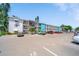 Exterior view of the condo building with parking lot at 2113 Canal Dr # B2, Bradenton, FL 34207